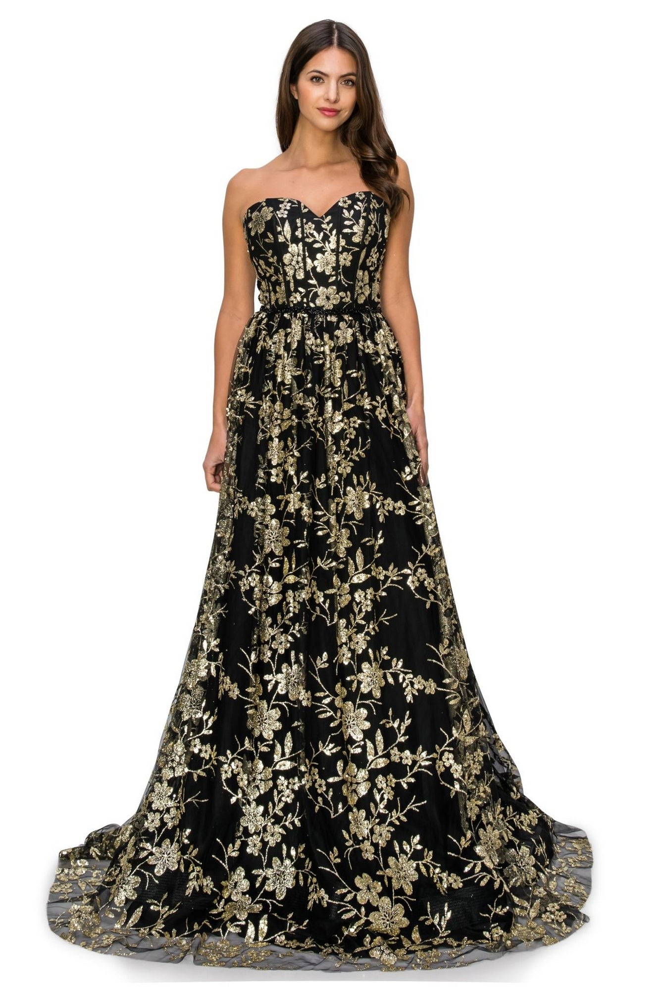 A woman stands facing forward in the Glitter-Floral Long Strapless Prom Dress 8043J, featuring black fabric with gold glitter floral embroidery.